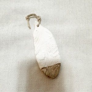 Free People clay feather ornament